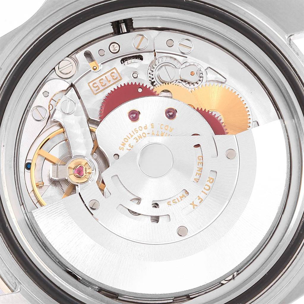 The image shows the inner mechanical movement of a Rolex Submariner 16610 Men's Stainless Steel Black Dial 16610 Men's Stainless Steel Black Dial watch from the back angle.