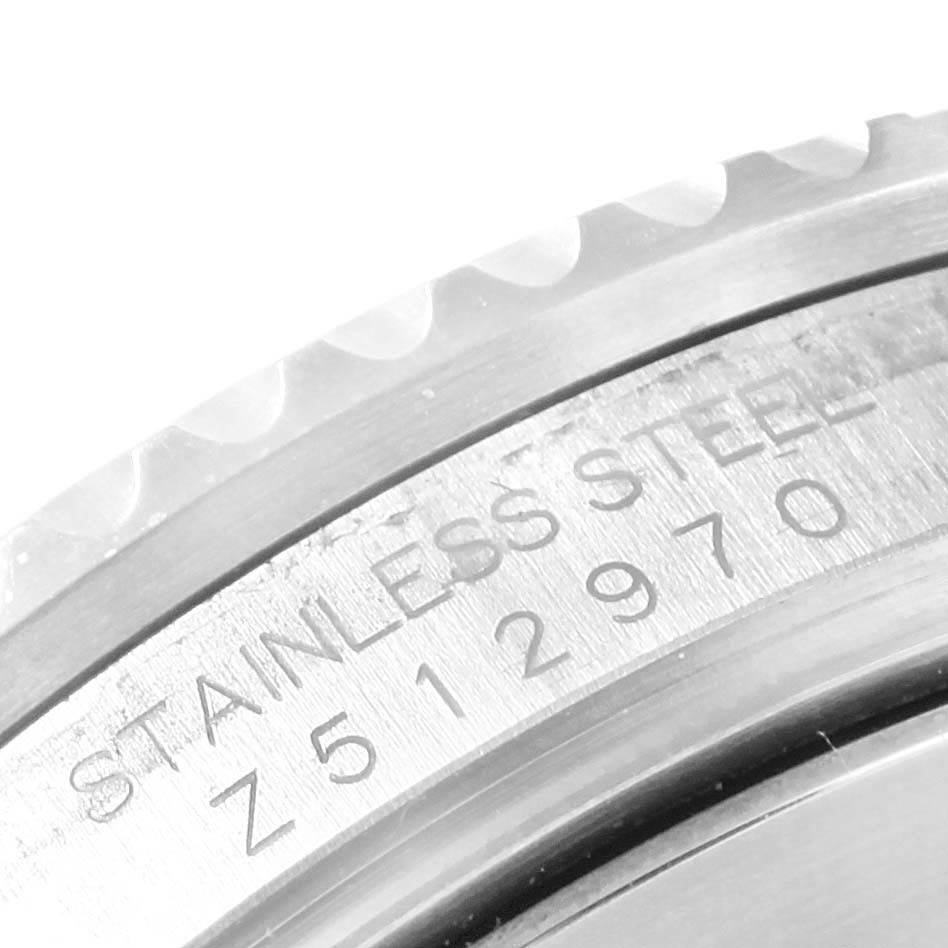 This image shows a close-up of the bezel and part of the case with serial number engraving of the Rolex Submariner 16610 Men's Stainless Steel Black Dial 16610 Men's Stainless Steel Black Dial.