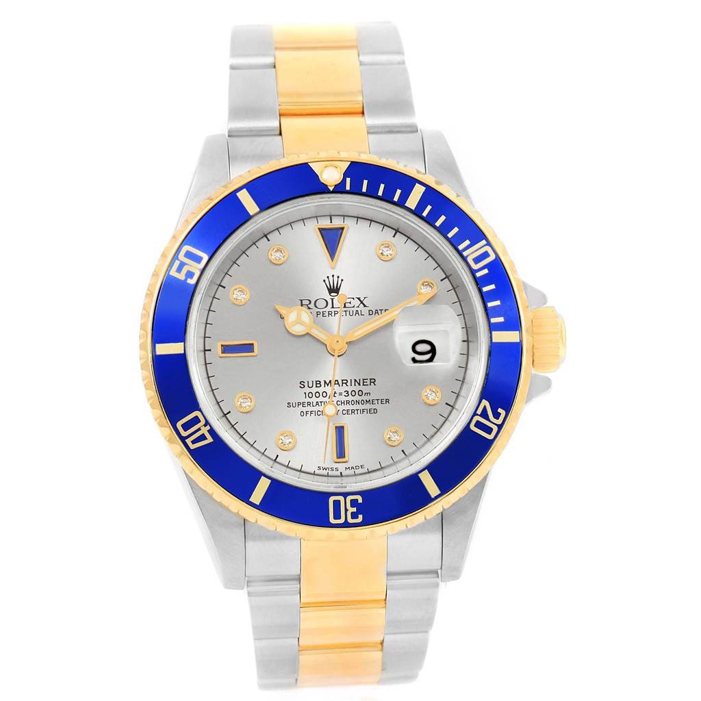 This Rolex Submariner 16613 Men's Steel and Gold (two tone) Grey Dial 16613 Men's Steel and Gold (two tone) Grey Dial watch is shown at a straight-on angle, highlighting its blue bezel, silver and gold case, and bracelet.