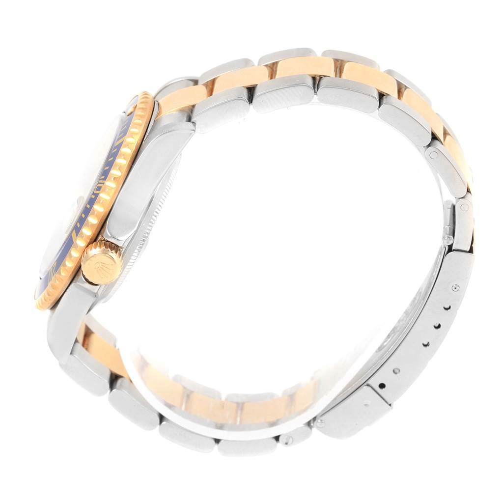 The image shows a side view of a Rolex Submariner 16613 Men's Steel and Gold (two tone) Grey Dial 16613 Men's Steel and Gold (two tone) Grey Dial watch, highlighting the case, bezel, crown, and bracelet.