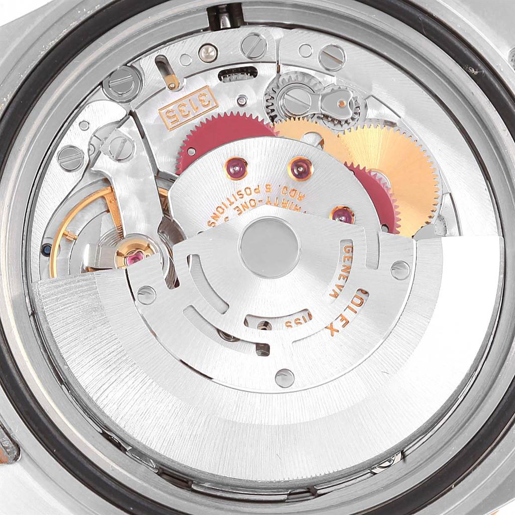 This image shows the internal movement mechanism of a Rolex Submariner 16613 Men's Steel and Gold (two tone) Blue Dial 16613 Men's Steel and Gold (two tone) Blue Dial watch from a close-up angle.