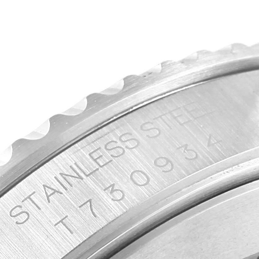 The image shows a close-up of the case back and engraving on a Rolex Submariner 14060 Men's Stainless Steel Black Dial 14060 Men's Stainless Steel Black Dial watch, highlighting the stainless steel material.