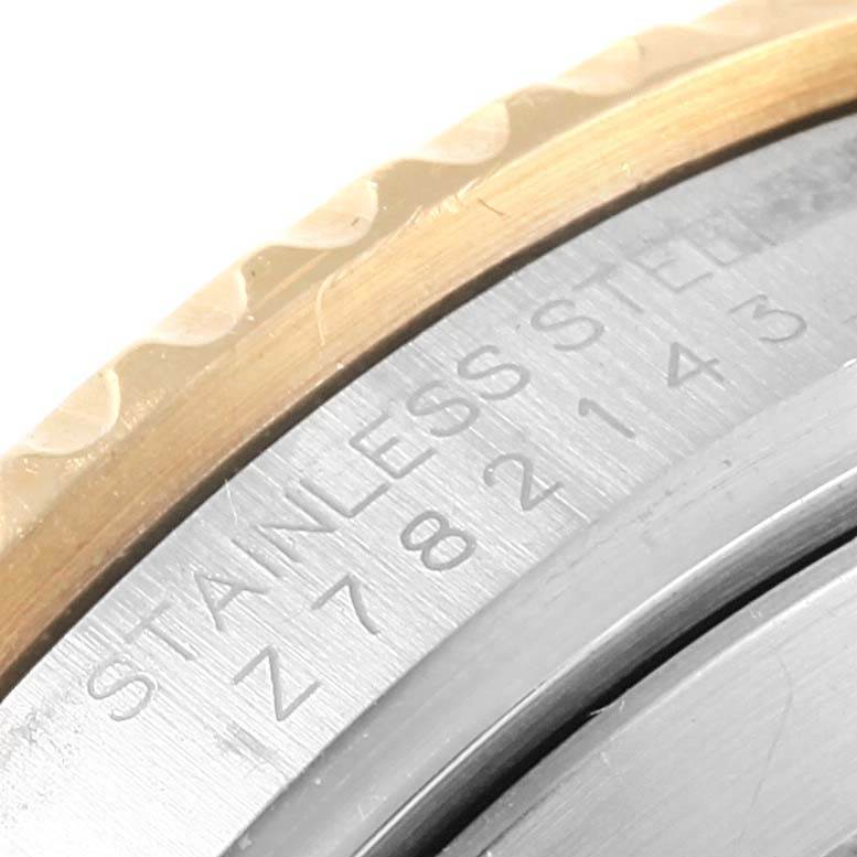 This close-up image shows the stainless steel caseback and part of the bezel of the Rolex Submariner 16613 Men's Steel and Gold (two tone) Blue Dial 16613 Men's Steel and Gold (two tone) Blue Dial watch.