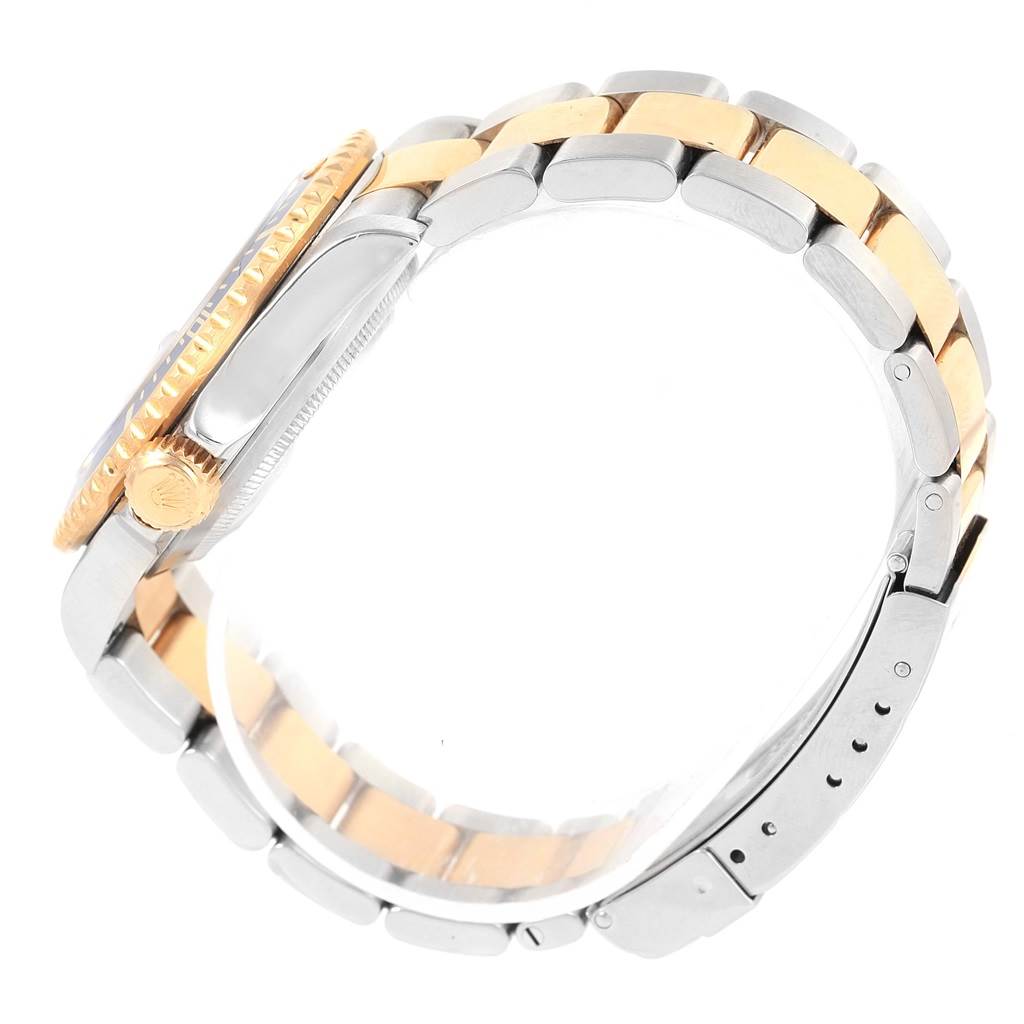 This side-angle image of the Rolex Submariner 16613 Men's Steel and Gold (two tone) Blue Dial 16613 Men's Steel and Gold (two tone) Blue Dial watch shows the bracelet, the side of the case, and the crown.