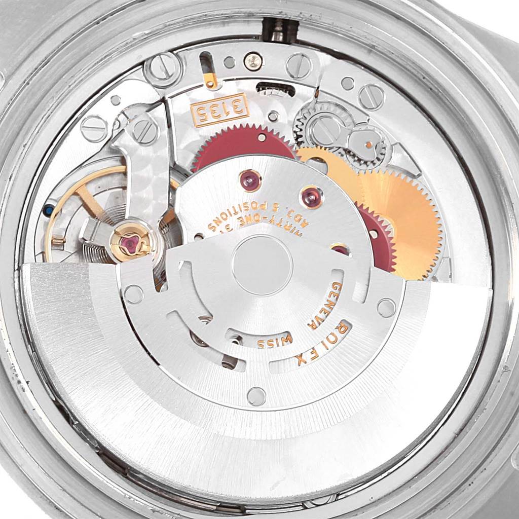 This image shows a close-up of the movement inside a Rolex Submariner 16613 Men's Steel and Gold (two tone) Blue Dial 16613 Men's Steel and Gold (two tone) Blue Dial watch from the back.