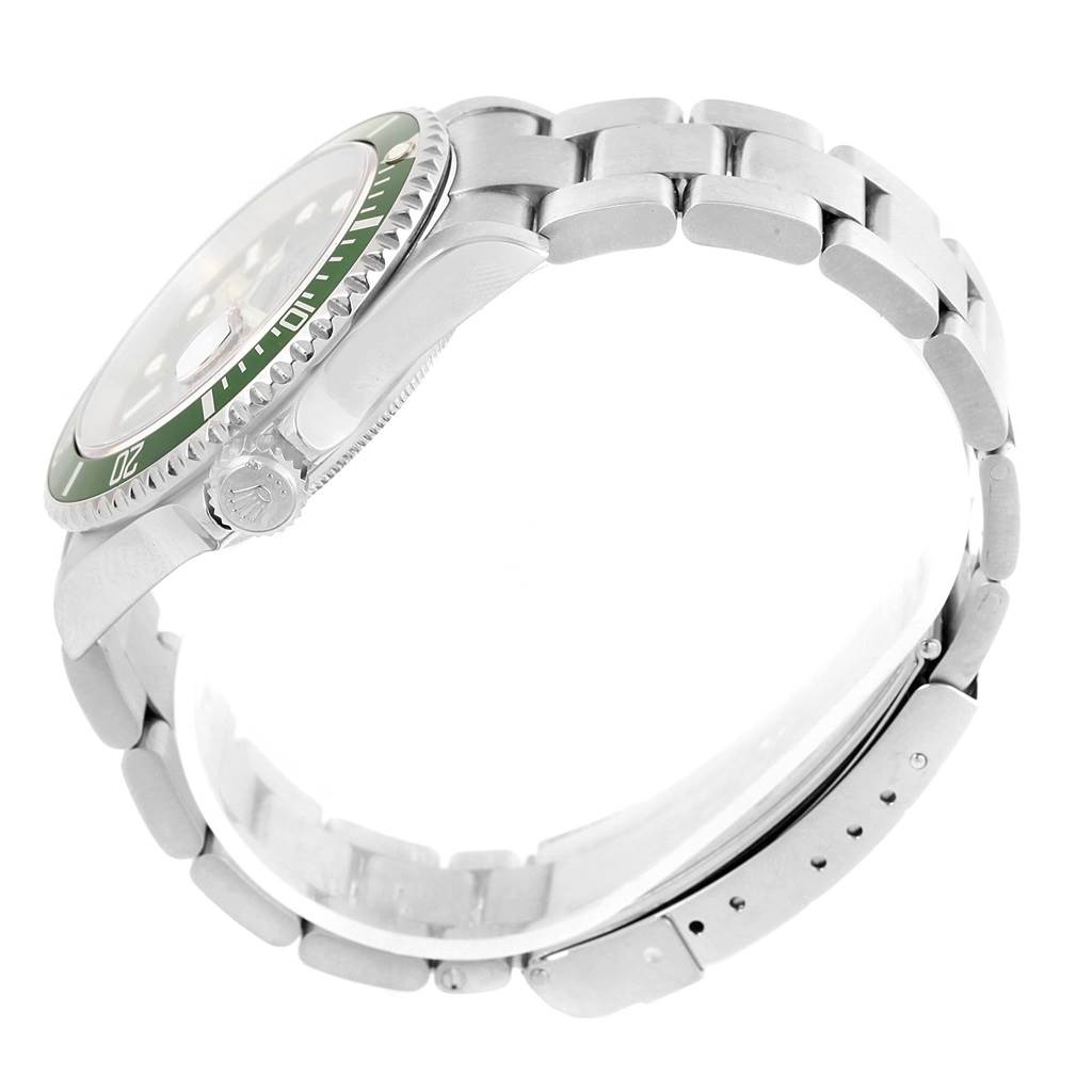 The image shows a side view of a Rolex Submariner 16610LV Men's Stainless Steel Black Dial 16610LV Men's Stainless Steel Black Dial watch, highlighting its green bezel, crown, and bracelet.