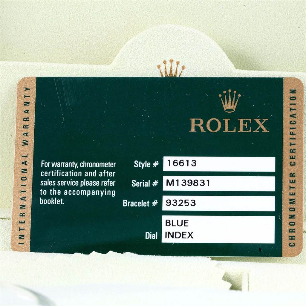 This image shows the international warranty card for a Rolex Submariner 16613 Men's Steel and Gold (two tone) Blue Dial 16613 Men's Steel and Gold (two tone) Blue Dial model, detailing style, serial, bracelet numbers, and dial color.