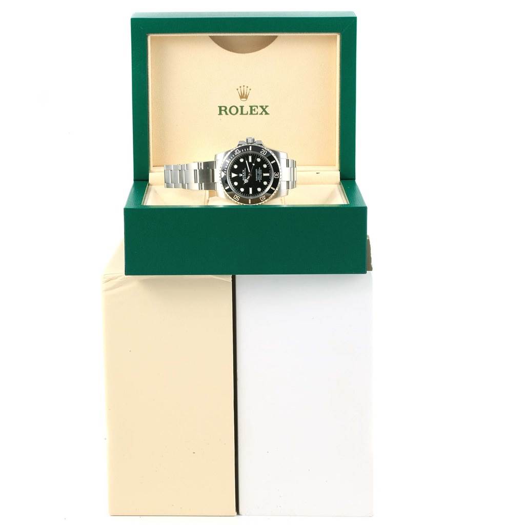 This image shows a Rolex Submariner 114060 Men's Stainless Steel Black Dial 114060 Men's Stainless Steel Black Dial watch from a front angle, displayed in its green box.