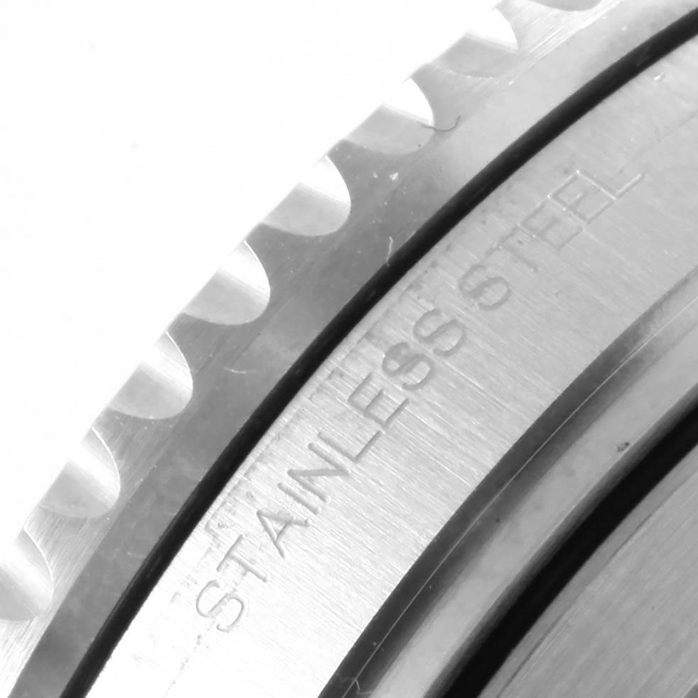 This image shows a close-up of the bezel and case with "STAINLESS STEEL" inscribed on a Rolex Submariner 114060 Men's Stainless Steel Black Dial 114060 Men's Stainless Steel Black Dial watch.