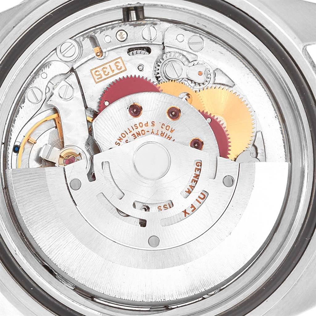 This image shows the movement mechanism of a Rolex Submariner 16613 Men's Steel and Gold (two tone) Blue Dial 16613 Men's Steel and Gold (two tone) Blue Dial watch from a rear angle, featuring gears and internal components.
