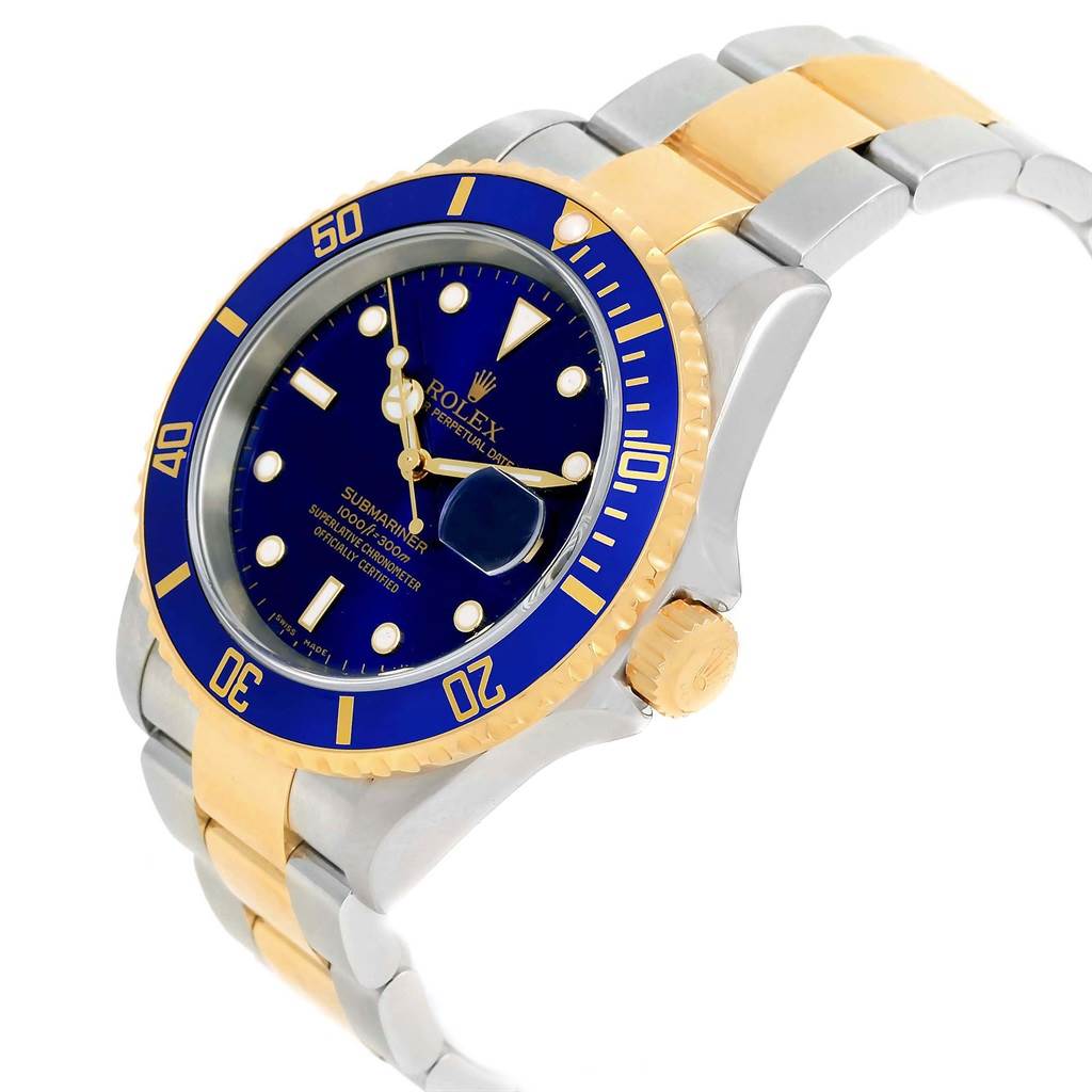 The Rolex Submariner 16613 Men's Steel and Gold (two tone) Blue Dial 16613 Men's Steel and Gold (two tone) Blue Dial is seen from a three-quarter angle, showcasing its blue dial, gold and silver bracelet, and rotating bezel.