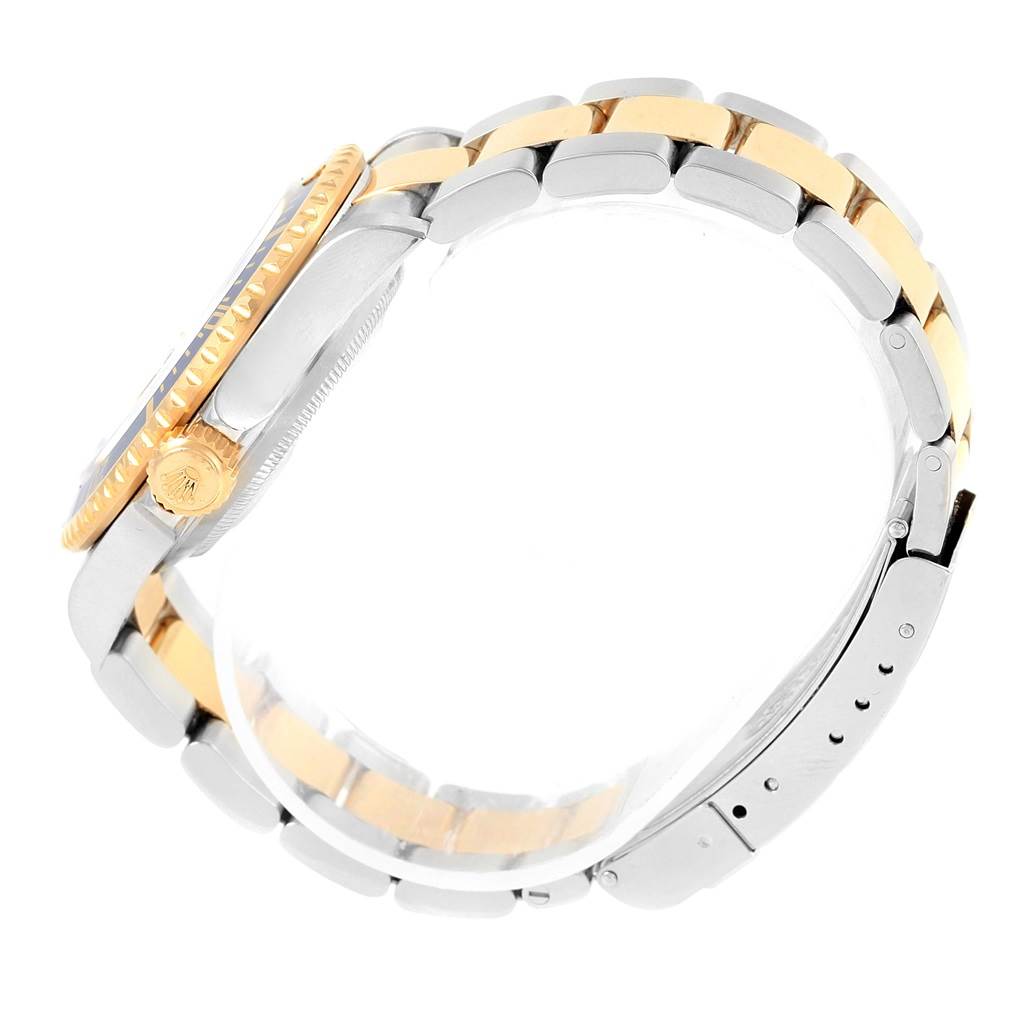 The image shows a side profile of a Rolex Submariner 16613 Men's Steel and Gold (two tone) Blue Dial 16613 Men's Steel and Gold (two tone) Blue Dial watch, highlighting the crown, bracelet, and clasp.