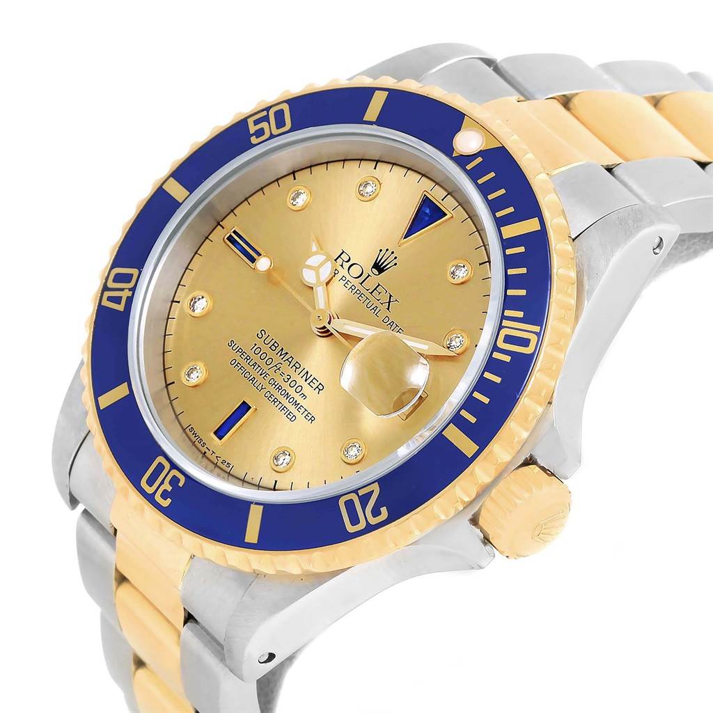 The image shows a close-up angled view of a Rolex Submariner 16613 Men's Steel and Gold (two tone) Champagne Dial 16613 Men's Steel and Gold (two tone) Champagne Dial watch, highlighting its face, bezel, crown, and two-tone bracelet.