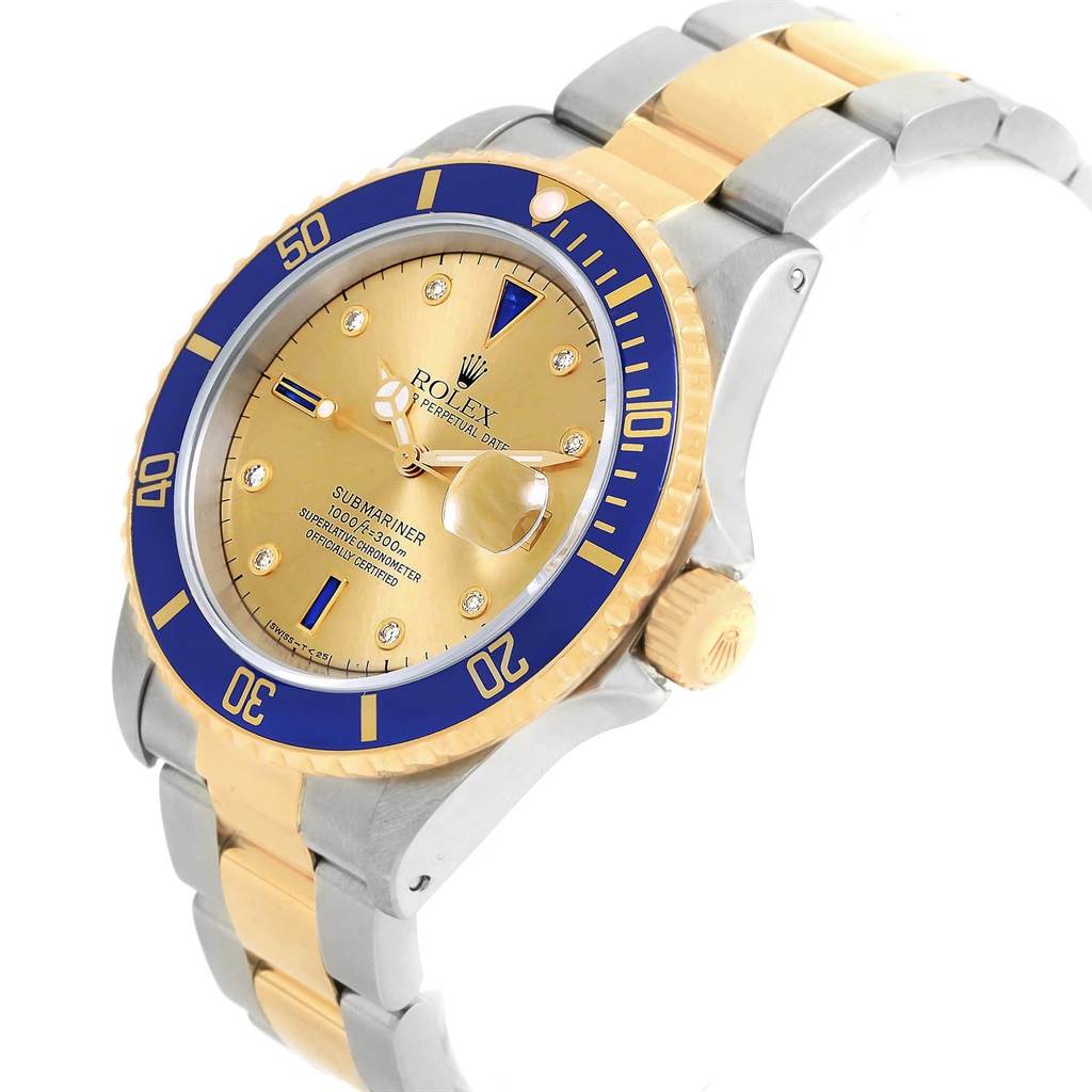 The image shows a Rolex Submariner 16613 Men's Steel and Gold (two tone) Champagne Dial 16613 Men's Steel and Gold (two tone) Champagne Dial watch from an angled side view, highlighting the dial, bezel, crown, and part of the bracelet.