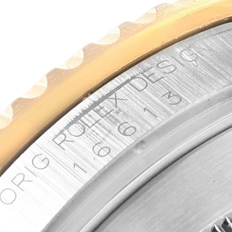 This image shows a close-up of the bezel and case back of the Rolex Submariner 16613 Men's Steel and Gold (two tone) Champagne Dial 16613 Men's Steel and Gold (two tone) Champagne Dial watch.