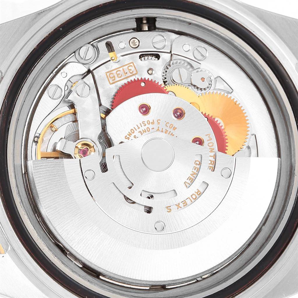 The image shows the internal mechanism of a Rolex Submariner 16613 Men's Steel and Gold (two tone) Champagne Dial 16613 Men's Steel and Gold (two tone) Champagne Dial watch viewed from the back.