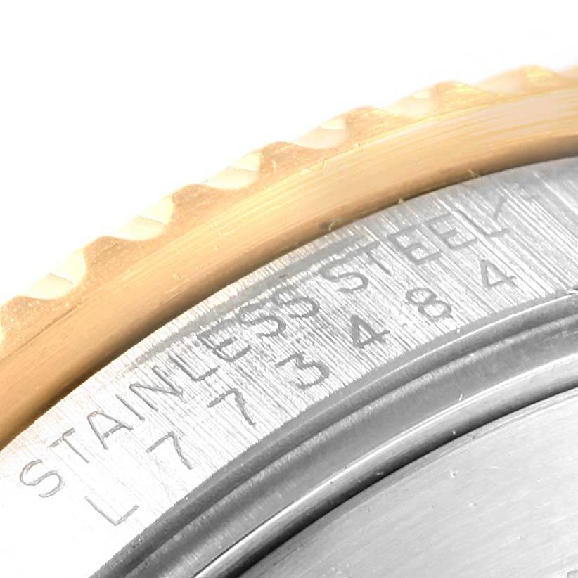 The image shows a close-up of the case back, serial number, and part of the bezel of a Rolex Submariner 16613 Men's Steel and Gold (two tone) Champagne Dial 16613 Men's Steel and Gold (two tone) Champagne Dial watch.