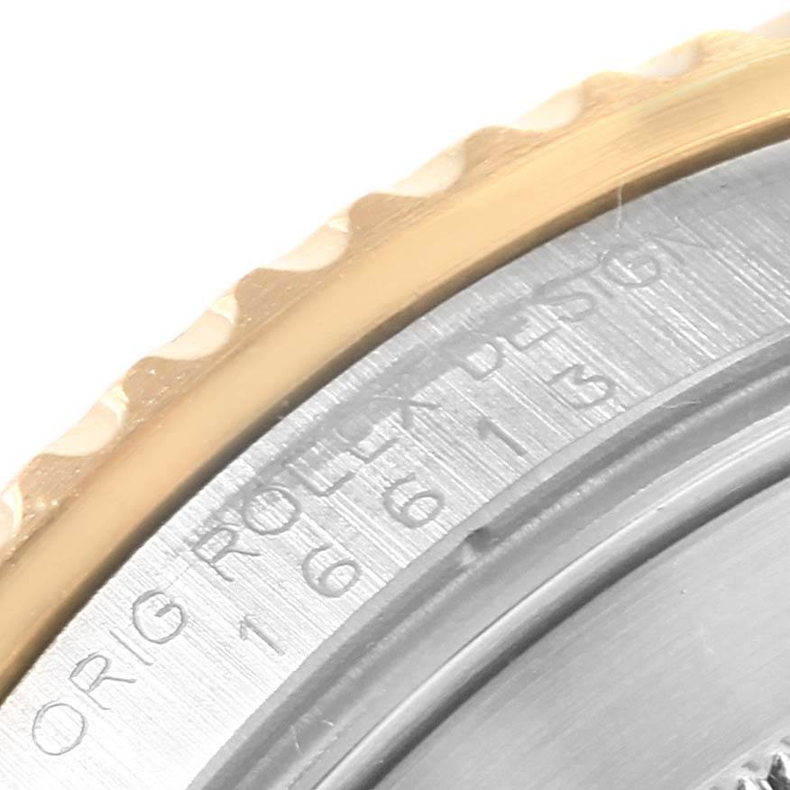 The image shows a close-up of the bezel and engraved side of the caseback of a Rolex Submariner 16613 Men's Steel and Gold (two tone) Champagne Dial 16613 Men's Steel and Gold (two tone) Champagne Dial watch.