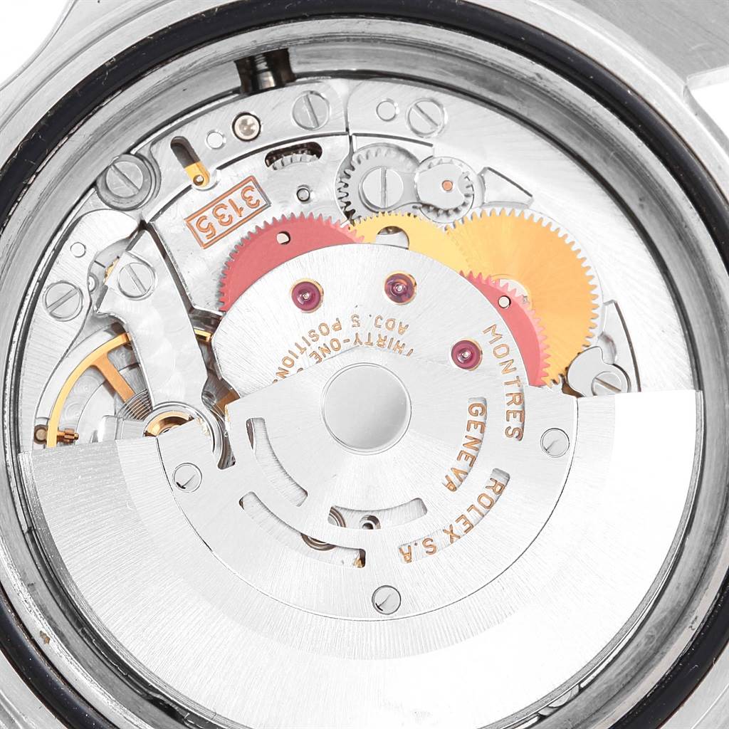 The image shows the inner mechanical movement and gears of a Rolex Submariner 16613 Men's Steel and Gold (two tone) Champagne Dial 16613 Men's Steel and Gold (two tone) Champagne Dial watch from a rear angle.