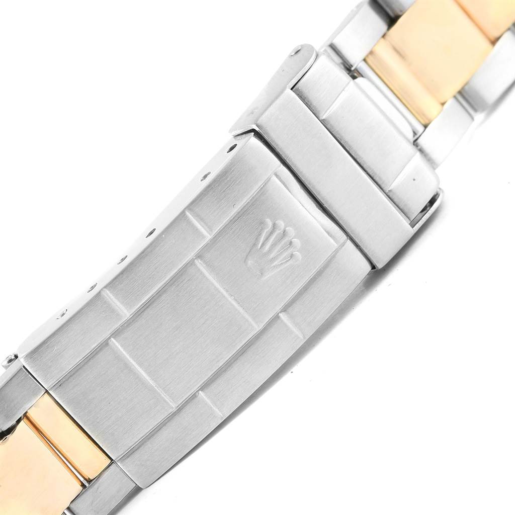 The image shows a close-up of the clasp and bracelet of a Rolex Submariner 16613 Men's Steel and Gold (two tone) Champagne Dial 16613 Men's Steel and Gold (two tone) Champagne Dial watch.