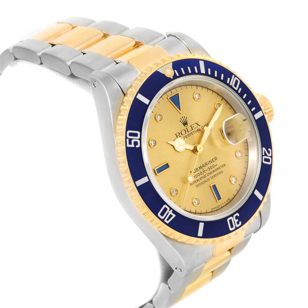 The image shows a side angle of a Rolex Submariner 16613 Men's Steel and Gold (two tone) Champagne Dial 16613 Men's Steel and Gold (two tone) Champagne Dial watch, highlighting the dial, bezel, and part of the band.