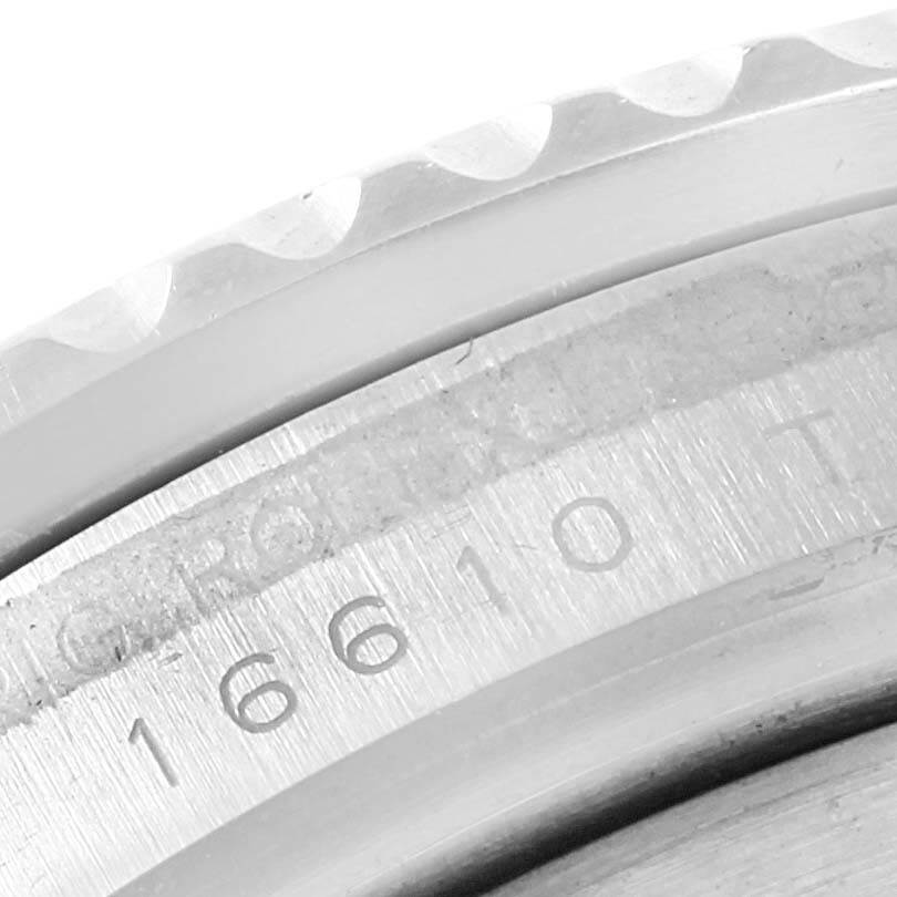 The image shows a close-up of the bezel and inner case with the "16610" model number of a Rolex Submariner 16610 Men's Stainless Steel Black Dial 16610 Men's Stainless Steel Black Dial watch.