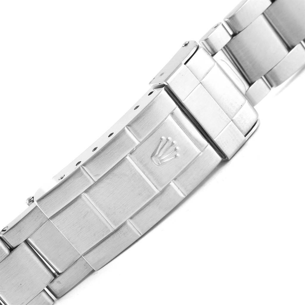 This image shows the clasp and part of the stainless steel bracelet of a Rolex Submariner 16610 Men's Stainless Steel Black Dial 16610 Men's Stainless Steel Black Dial watch.