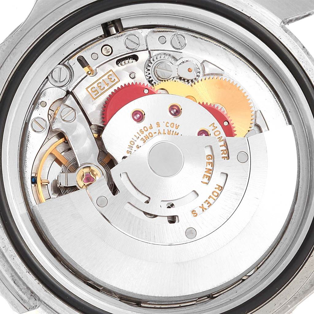 This image shows the inner mechanism and movement of the Rolex Submariner 16610 Men's Stainless Steel Black Dial 16610 Men's Stainless Steel Black Dial watch from a rear angle.