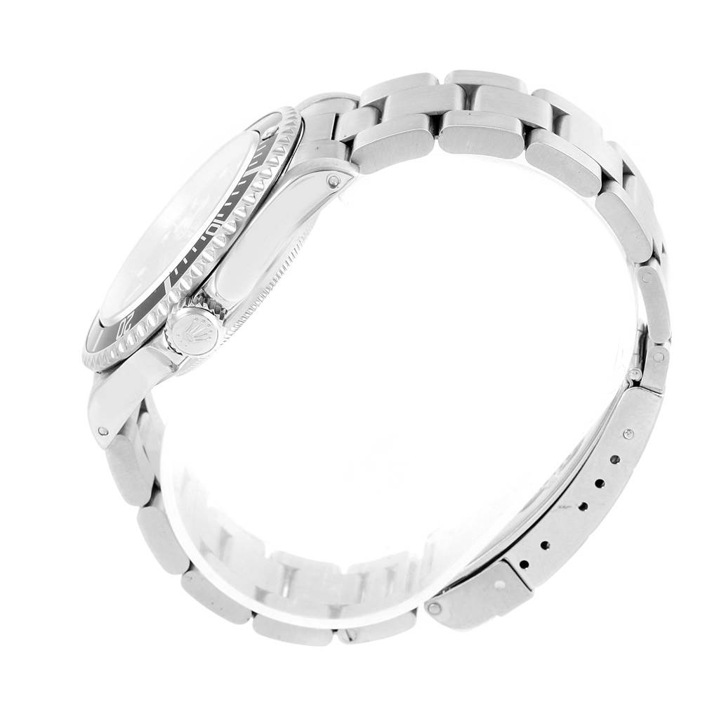 The image shows a side view of a Rolex Submariner 14060 Men's Stainless Steel Black Dial 14060 Men's Stainless Steel Black Dial watch, highlighting the crown, bezel, and bracelet.