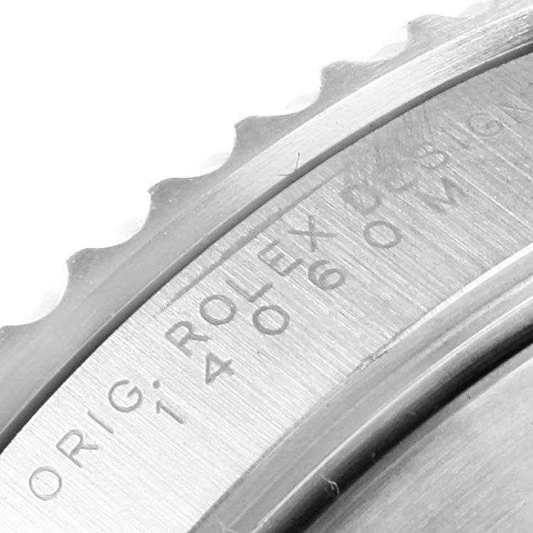 This image shows a close-up of the bezel and etched markings on the Rolex Submariner 14060 Men's Stainless Steel Black Dial 14060 Men's Stainless Steel Black Dial watch.