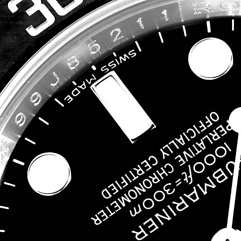 This close-up image shows part of the dial on a Rolex Submariner 116610 Men's Stainless Steel Black Dial 116610 Men's Stainless Steel Black Dial, including the "Swiss Made" text and the depth rating.