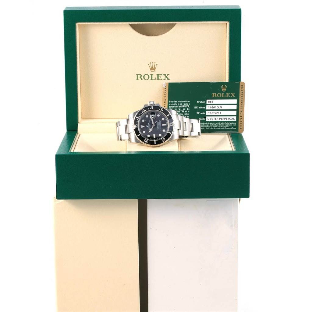 The Rolex Submariner 116610 Men's Stainless Steel Black Dial 116610 Men's Stainless Steel Black Dial watch is displayed inside its open box with a warranty card beside it.
