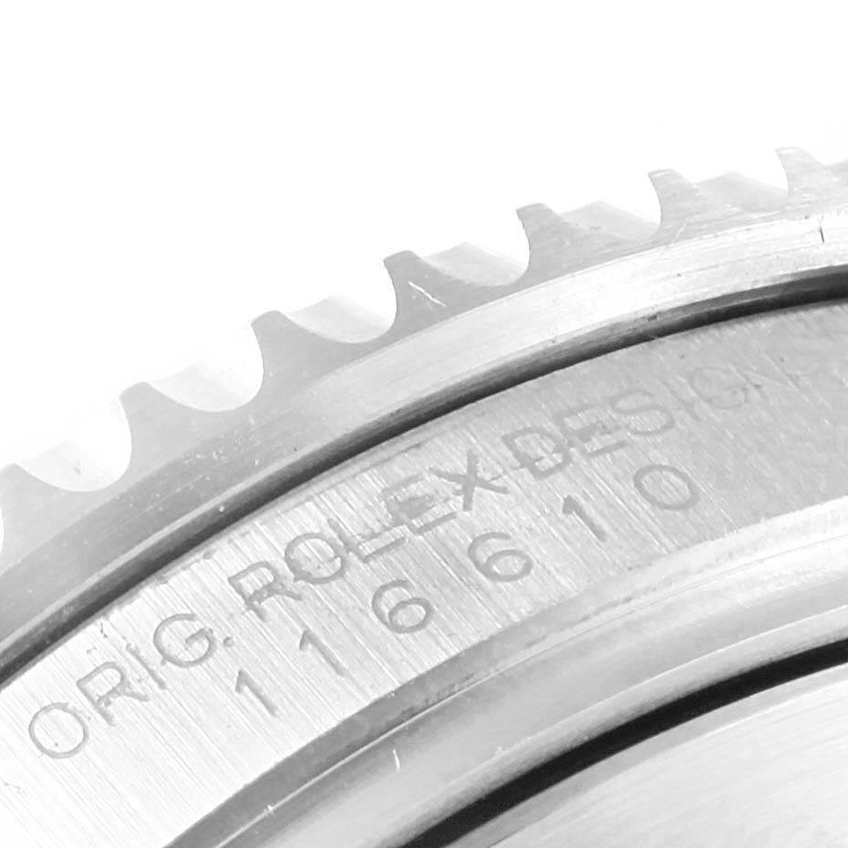 This close-up image shows part of the bezel and engraved caseback of a Rolex Submariner 116610LV Men
s Stainless Steel Green Dial 116610LV Men
s Stainless Steel Green Dial watch.