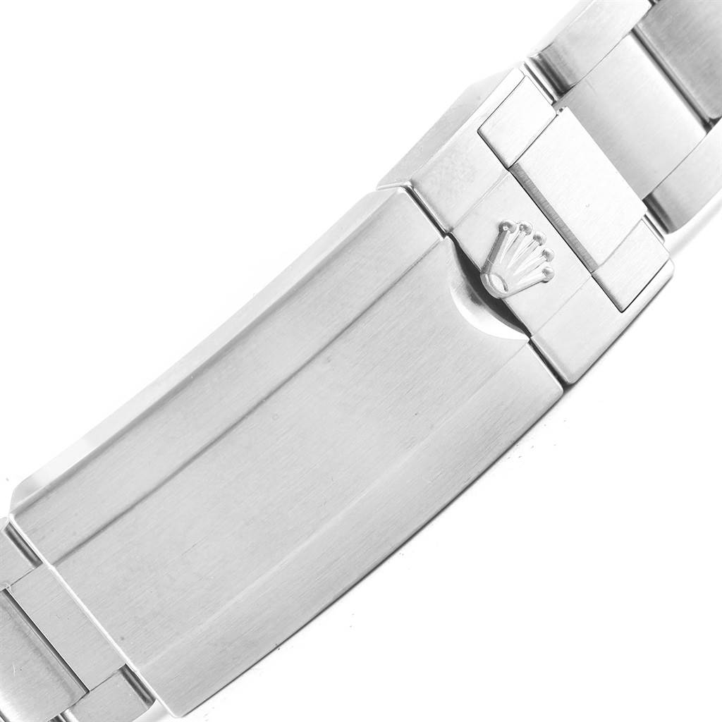 This image shows a close-up of the clasp on a Rolex Submariner 116610LV Men
s Stainless Steel Green Dial 116610LV Men
s Stainless Steel Green Dial watch bracelet, displaying the Rolex logo.