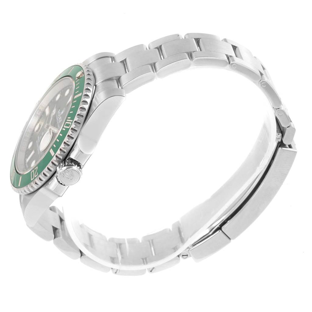The image shows a side view of a Rolex Submariner 116610LV Men
s Stainless Steel Green Dial 116610LV Men
s Stainless Steel Green Dial watch, highlighting its bracelet, clasp, and partially visible green bezel.