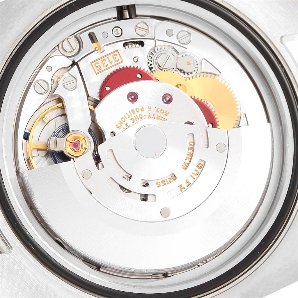 This image shows a close-up view of the movement mechanism inside a Rolex Submariner 116610LV Men
s Stainless Steel Green Dial 116610LV Men
s Stainless Steel Green Dial watch.