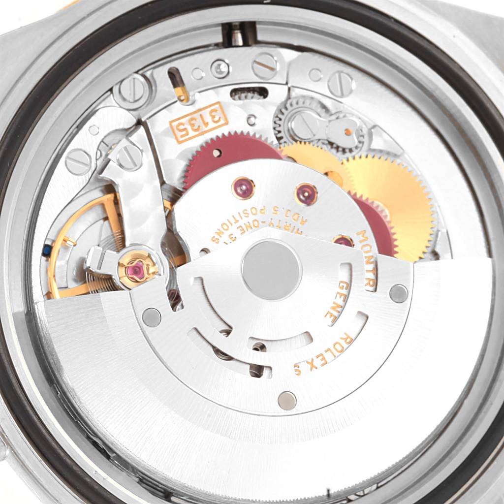 This image shows the intricate internal mechanics of a Rolex Submariner 16613 Men's Steel and Gold (two tone) Blue Dial 16613 Men's Steel and Gold (two tone) Blue Dial watch, viewed from the back.