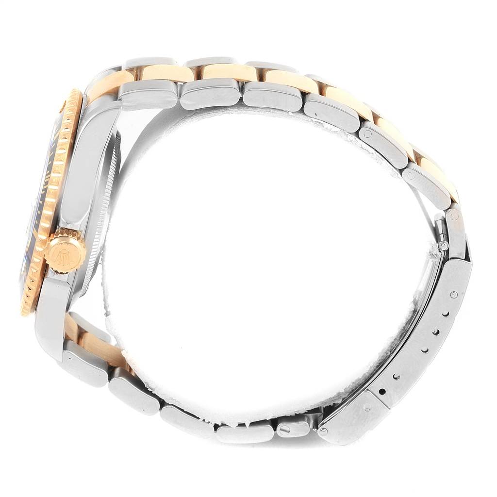 This image shows a side view of a Rolex Submariner 16613 Men's Steel and Gold (two tone) Black Dial 16613 Men's Steel and Gold (two tone) Black Dial watch, highlighting the band, bezel, and crown.