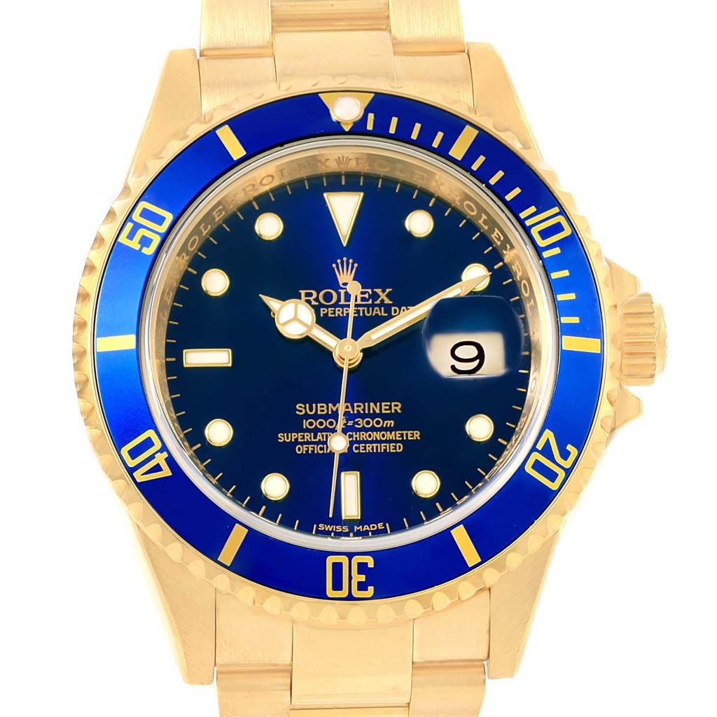 This image shows a frontal view of the Rolex Submariner 16618 Men's Yellow Gold Blue Dial 16618 Men's Yellow Gold Blue Dial watch, highlighting its blue dial and bezel, gold bracelet, and date window.