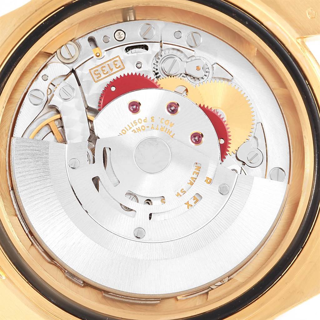 This image shows the intricate internal mechanism and automatic movement of a Rolex Submariner 16618 Men's Yellow Gold Blue Dial 16618 Men's Yellow Gold Blue Dial watch from a close-up, rear view angle.