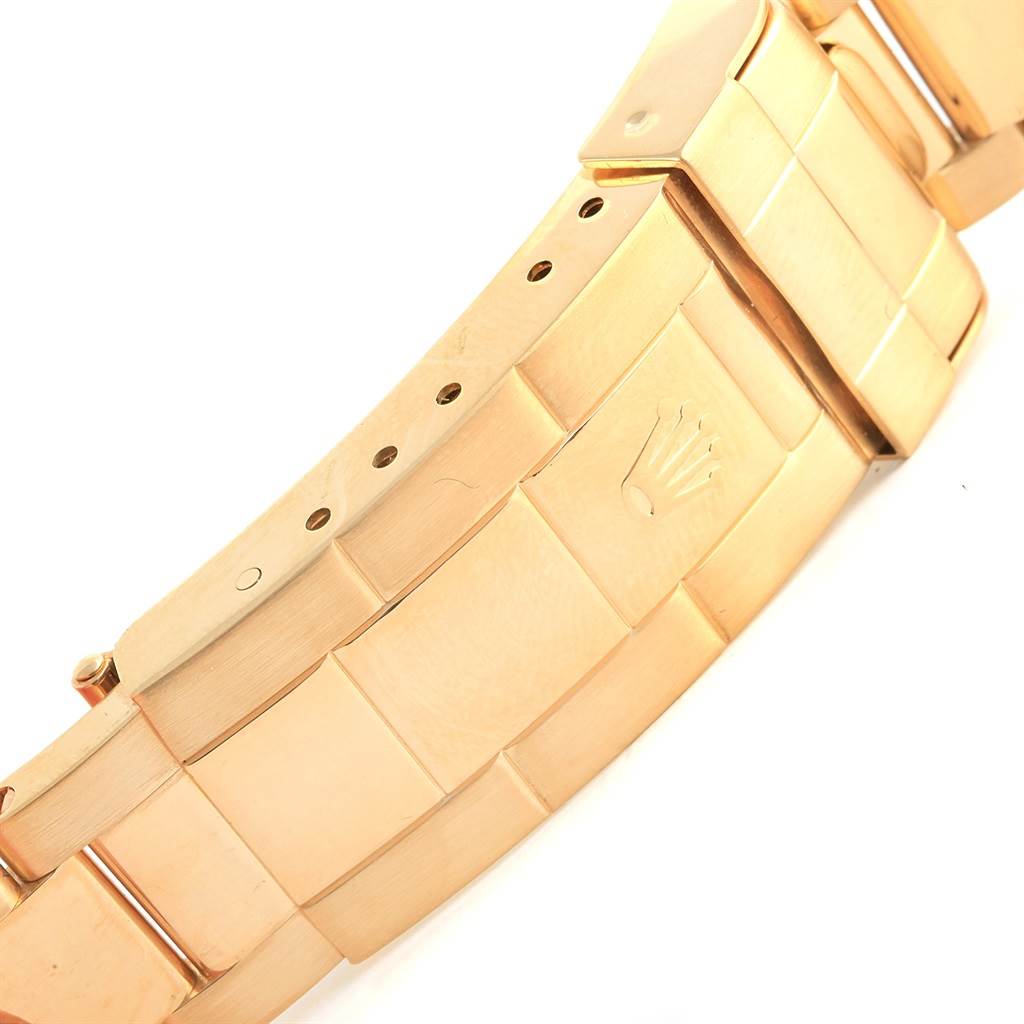 The image shows a close-up of the clasp and bracelet of a Rolex Submariner 16618 Men's Yellow Gold Blue Dial 16618 Men's Yellow Gold Blue Dial watch.