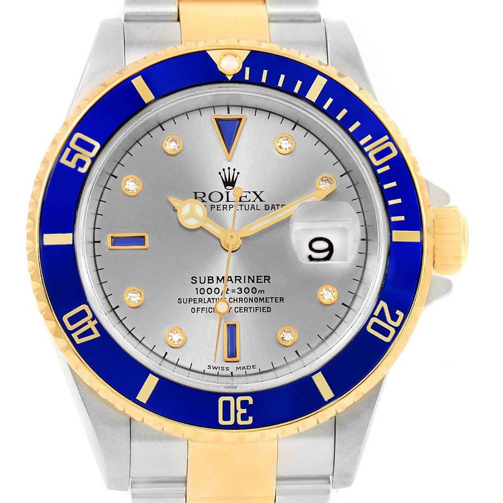 The image shows a Rolex Submariner 16613 Men's Steel and Gold (two tone) Grey Dial 16613 Men's Steel and Gold (two tone) Grey Dial watch from a front angle, highlighting the bezel, dial, and bracelet.