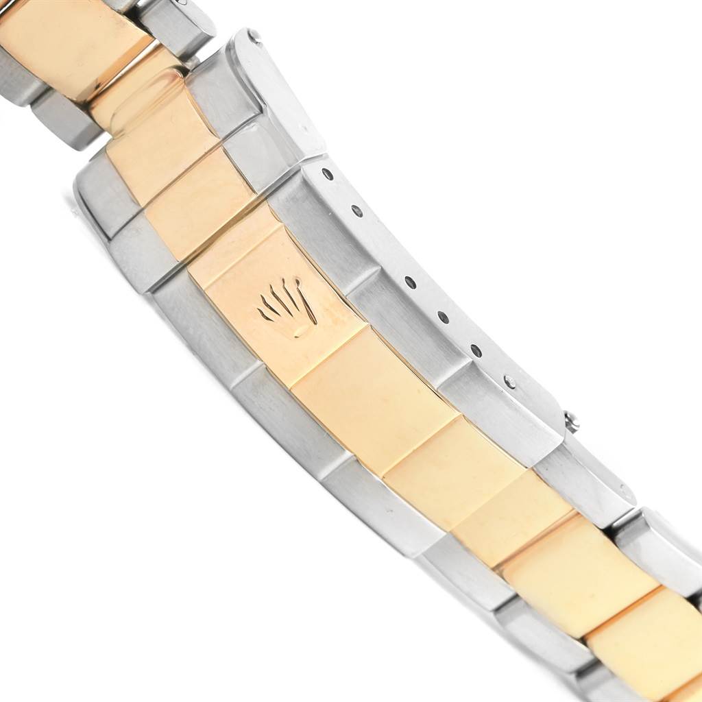 This image shows the close-up of the two-tone bracelet and clasp of the Rolex Submariner 16613 Men's Steel and Gold (two tone) Grey Dial 16613 Men's Steel and Gold (two tone) Grey Dial watch.