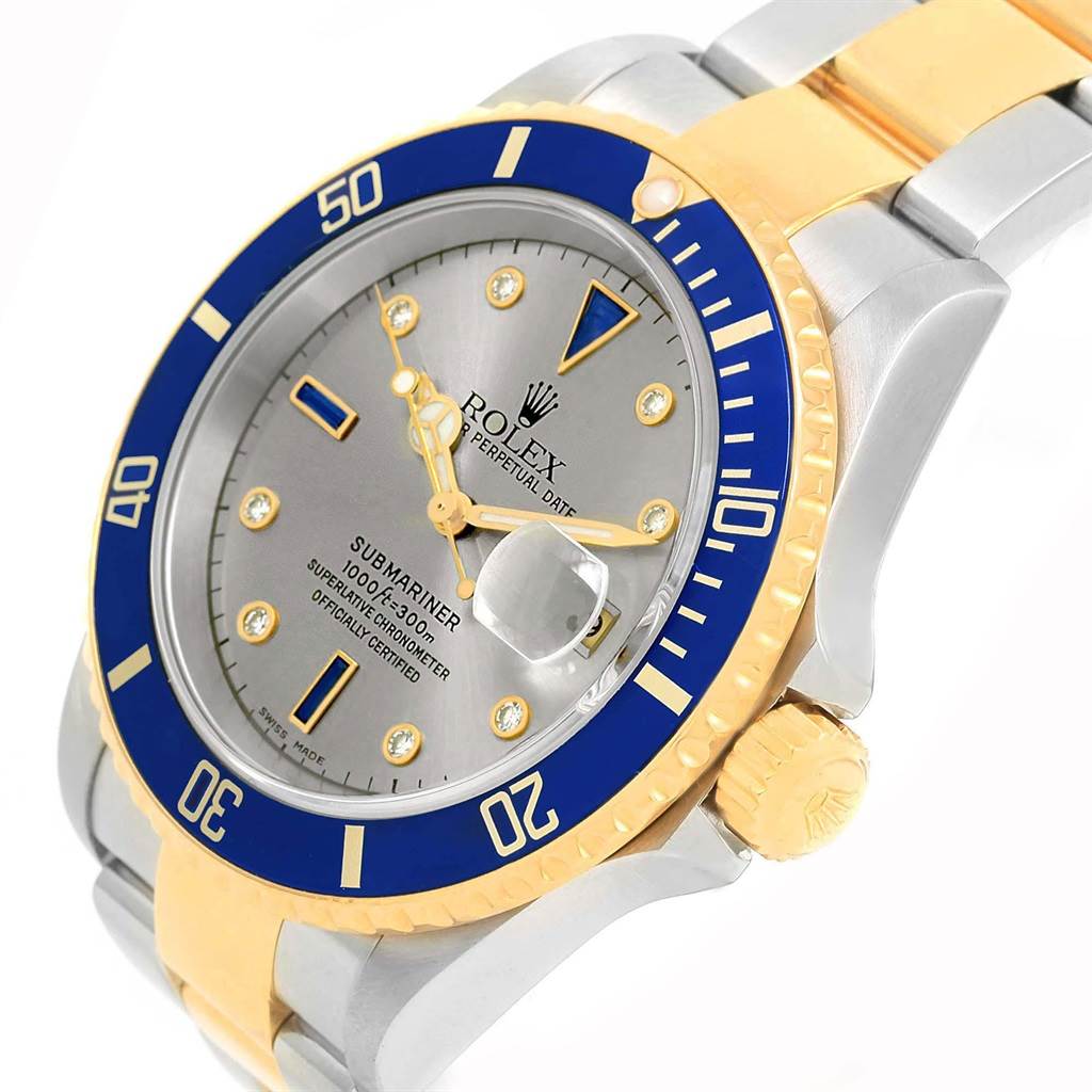 This Rolex Submariner 16613 Men's Steel and Gold (two tone) Grey Dial 16613 Men's Steel and Gold (two tone) Grey Dial watch is shown at an angle highlighting the dial, bezel, and a portion of the bracelet.