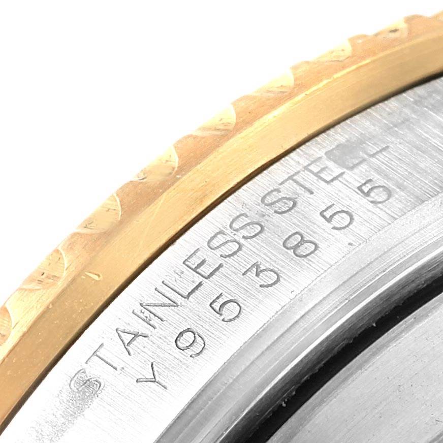 This image shows a close-up of the serial number and stainless steel inscription on the case back of a Rolex Submariner 16613 Men's Steel and Gold (two tone) Grey Dial 16613 Men's Steel and Gold (two tone) Grey Dial watch.