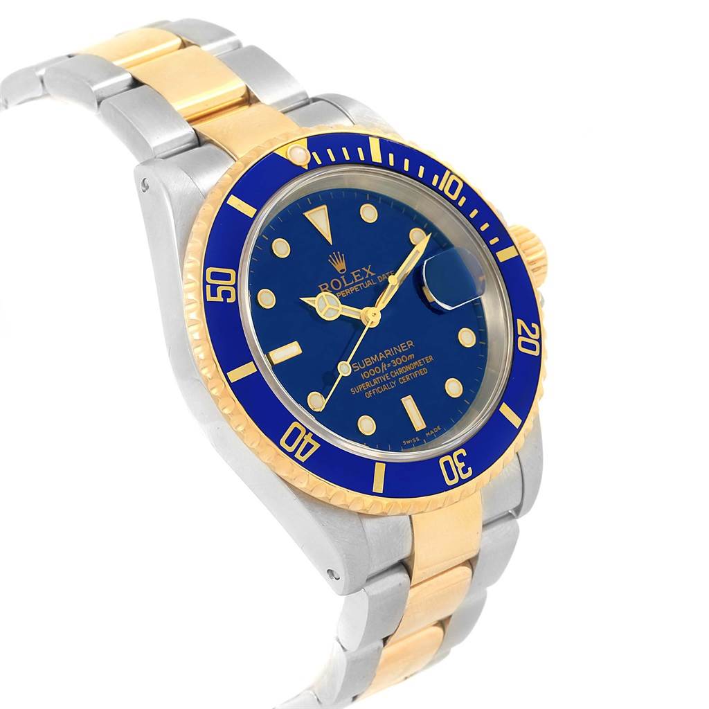 The Rolex Submariner 16613 Men's Steel and Gold (two tone) Blue Dial 16613 Men's Steel and Gold (two tone) Blue Dial watch is shown at a slight angle, displaying the blue dial, rotating bezel, and two-tone bracelet.