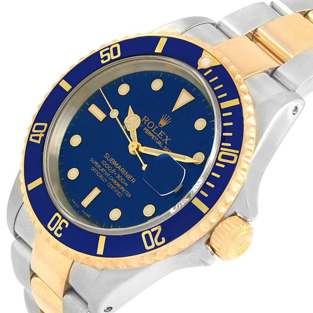 The image shows a close-up angled view of a Rolex Submariner 16613 Men's Steel and Gold (two tone) Blue Dial 16613 Men's Steel and Gold (two tone) Blue Dial watch, highlighting the dial, bezel, crown, and bracelet.