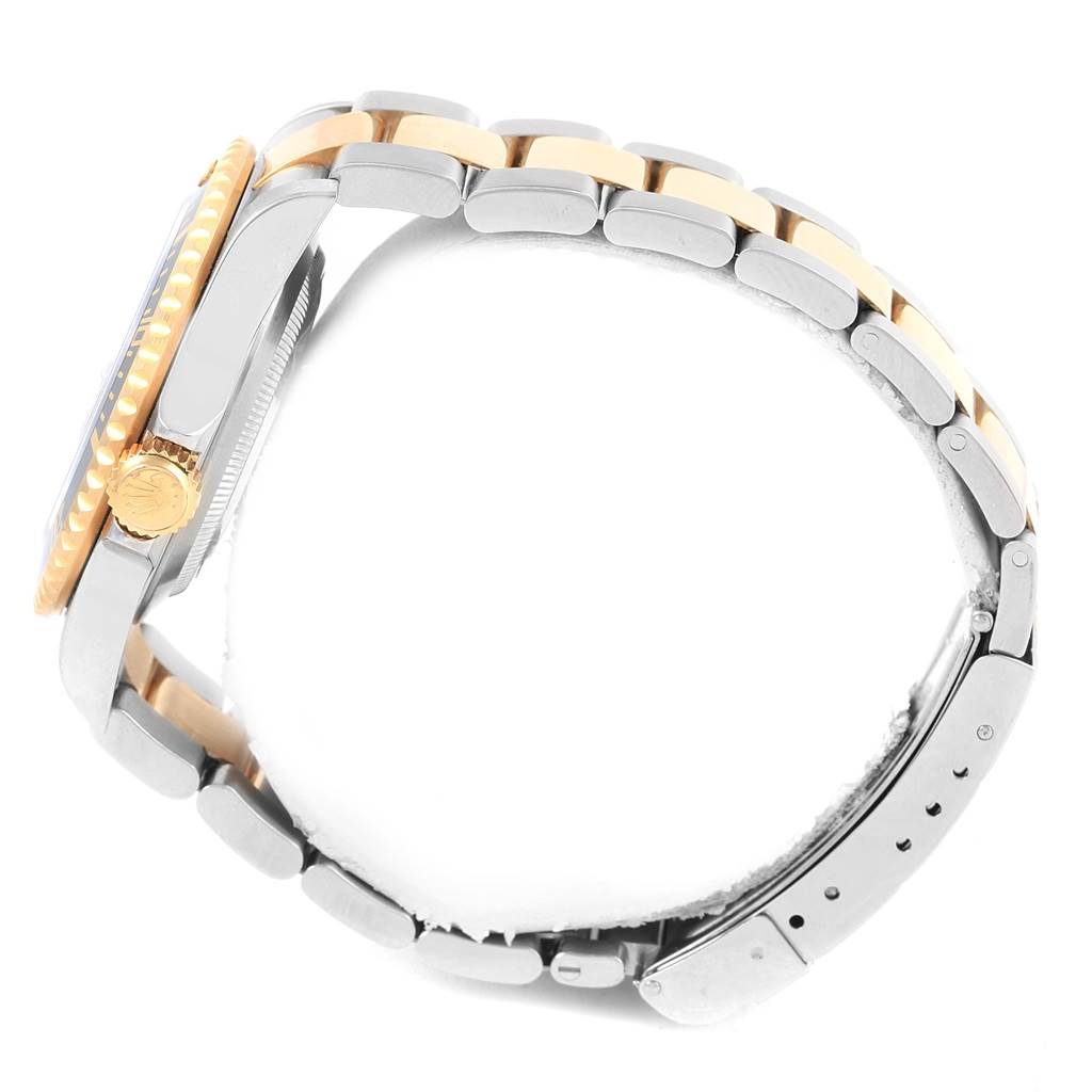 This image shows a side view of a Rolex Submariner 16613 Men's Steel and Gold (two tone) Black Dial 16613 Men's Steel and Gold (two tone) Black Dial, highlighting its two-tone bracelet and the crown on the side.