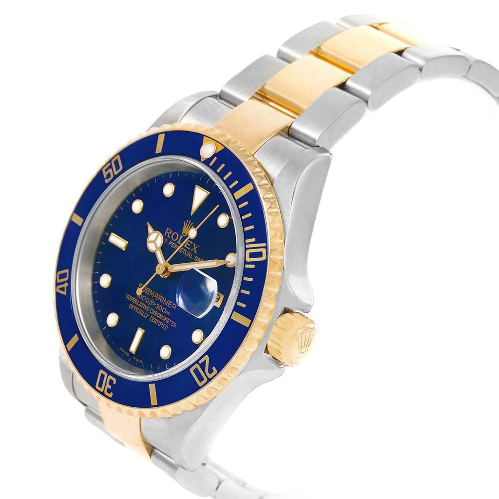 This image shows a close-up of a Rolex Submariner 16613 Men's Steel and Gold (two tone) Blue Dial 16613 Men's Steel and Gold (two tone) Blue Dial watch at an angle, highlighting its blue dial, bezel, and two-tone metal bracelet.