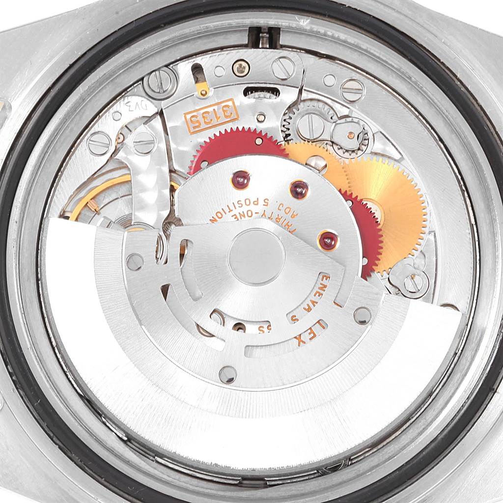 The image shows an internal close-up view of the Rolex Submariner 16613 Men's Steel and Gold (two tone) Blue Dial 16613 Men's Steel and Gold (two tone) Blue Dial watch movement and mechanisms.